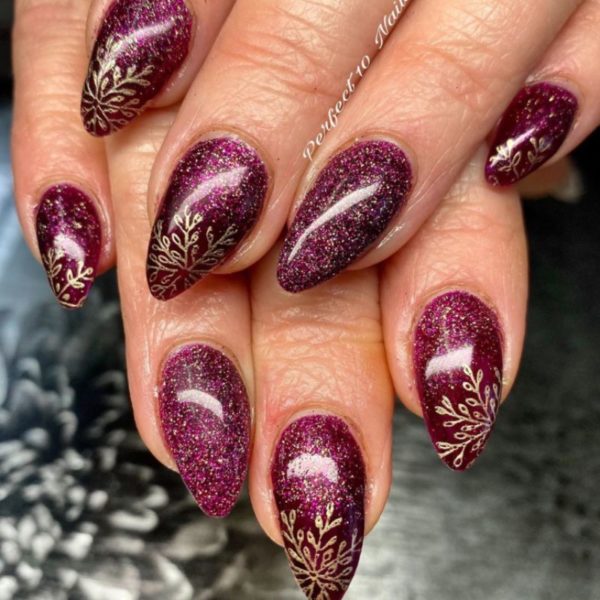 @perfect10nailsx adds a touch of luxe with burgundy glitter