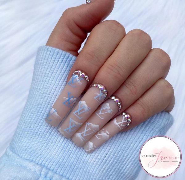 Chic clouds and designer details by @nailsbyjanine.x