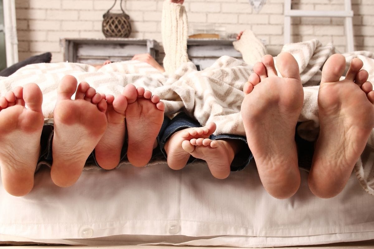 Feet In The Bed