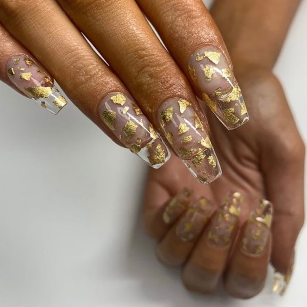 Gold flakes add a touch of luxe to this look by @haus_of_beaute