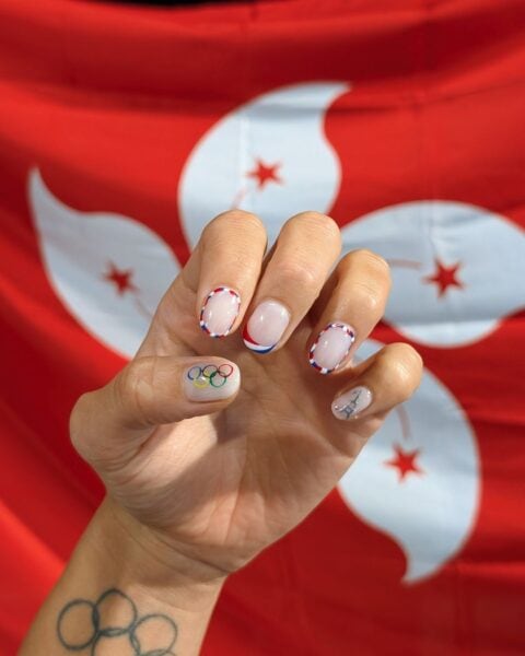 Swimmer for Team Hong Kong, @camillelcheng, shared this snap of her Olympics 2024 nail look by salon, Tinted.