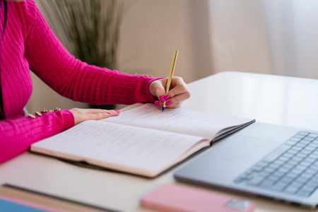 Crop Anonymous Female Student Doing Homeworks