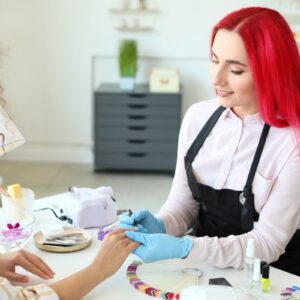 Nail Tech At Desk Red Hair Gloves