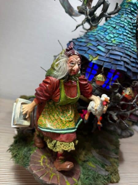 Close-up of colourful dragon figurine with blue wings