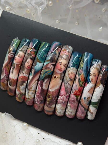 Hand-painted portrait nail art displayed on black background
