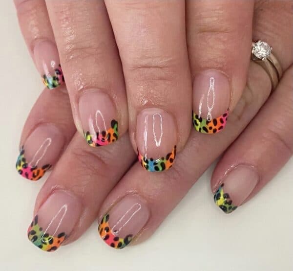Nude nails with bright multicoloured leopard print French tips