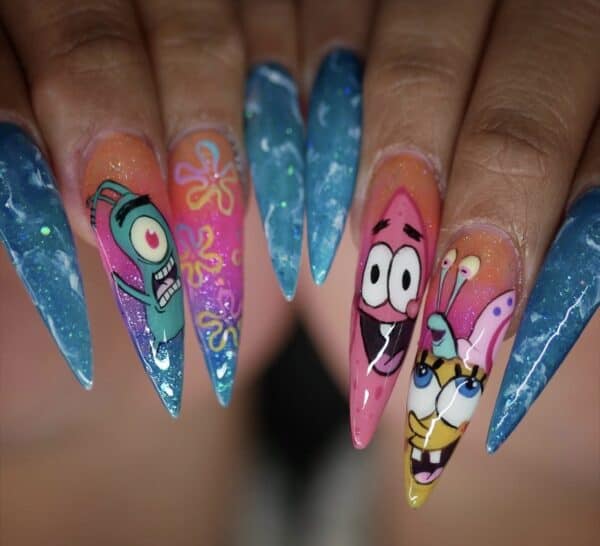 SpongeBob-inspired cartoon nail art on long glittery stiletto nails