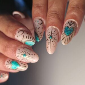 Nude nails with turquoise glitter and gold floral designs