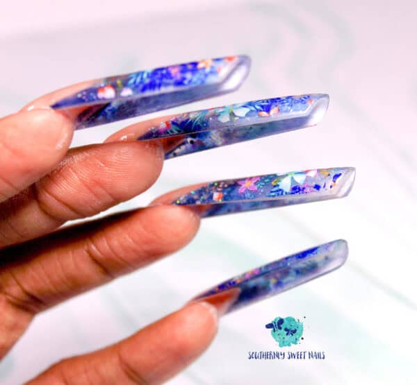 Long clear acrylic nails with colourful floral confetti