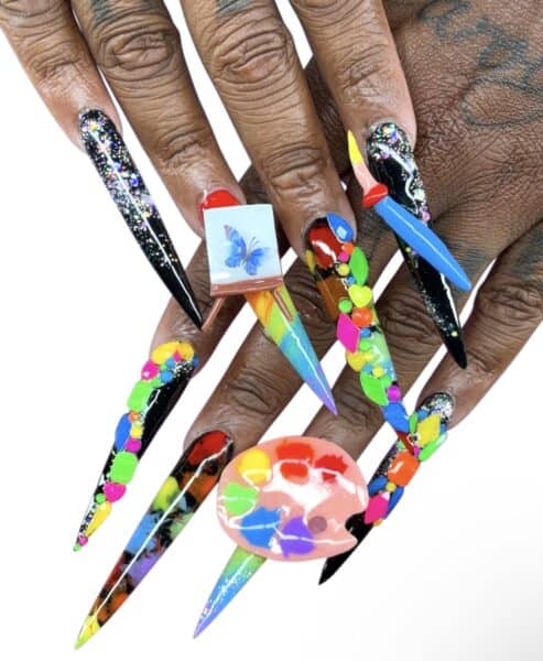 Colourful extra-long stiletto nails with artistic 3D embellishments
