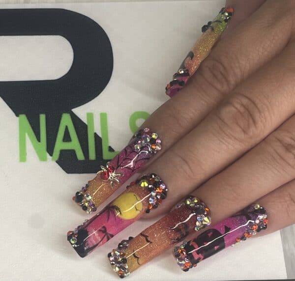 Long vibrant pink, orange and yellow rhinestone acrylic nails