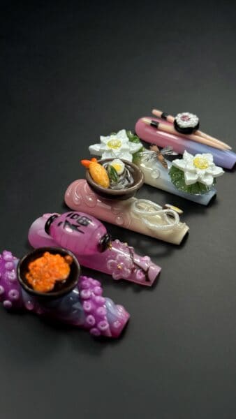 Colourful handmade glass beads with floral and animal motifs
