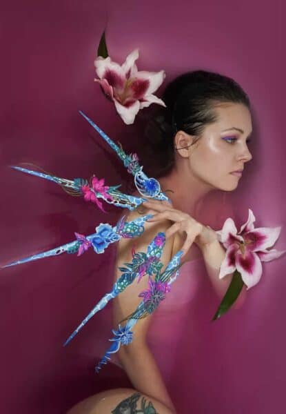 Profile portrait with floral fantasy body art and lilies