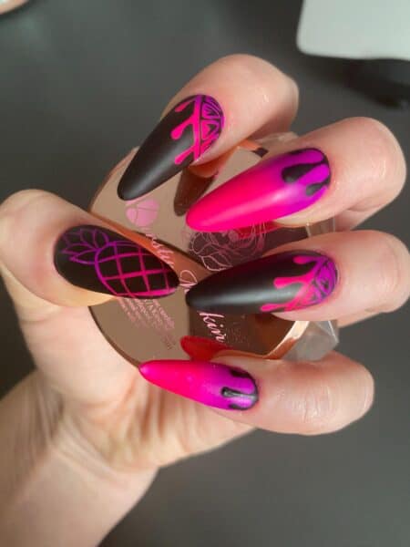 Hot pink and black patterned stiletto nail art