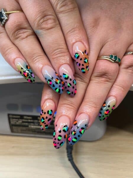 Neon leopard print almond nails with pastel gradient backgrounds