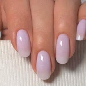 Close-up of glossy pale lavender almond-shaped manicure