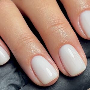 Glossy milky white manicure on short square nails
