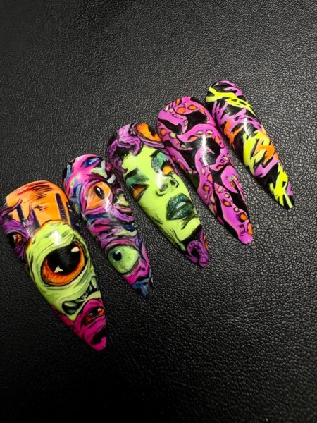 Five neon graffiti-style false nails on black background