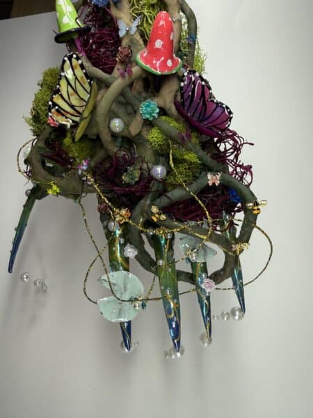 Fantasy tree sculpture with butterflies, mushroom and fairy lights