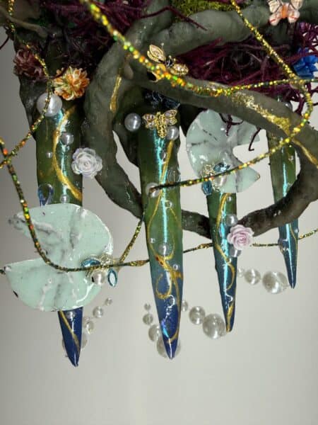Decorated fantasy green resin hands with pearls and gems