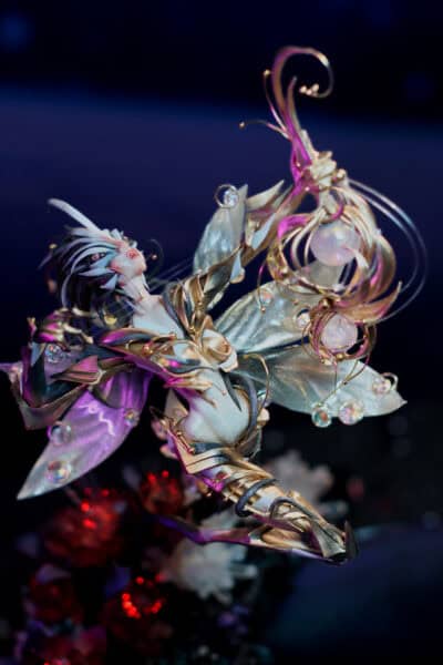 Ornate fantasy figurine with gold spikes and crystal ornaments