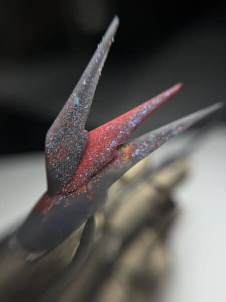 Close-up of glittery false eyelashes with red accents