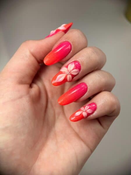 Bright pink and orange floral nail art