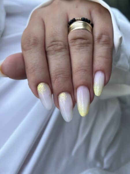 Hand with pearlescent glitter nails