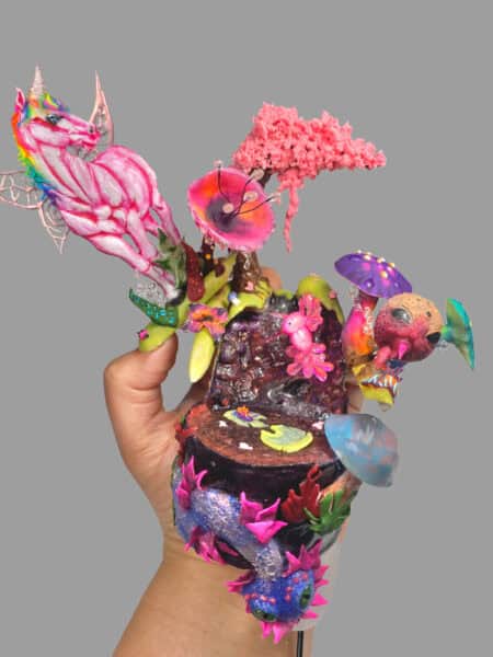 Colourful fantasy tree sculpture with unicorn and mushrooms