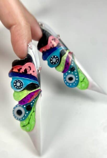 Colourful abstract nail art on long sculpted nails