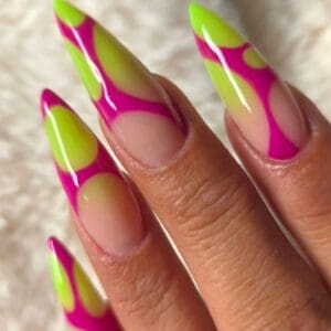 Long neon green and pink abstract-patterned acrylic nails