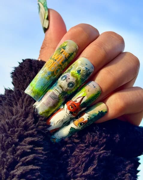 Hand with colourful woodland animal-themed nail art
