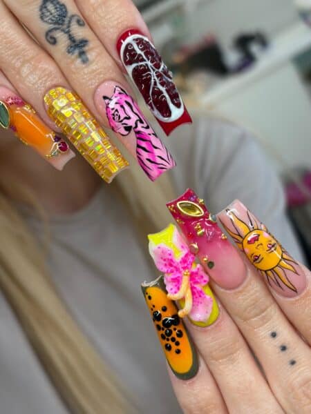 Colourful sculpted nail art with cartoon animals and gems