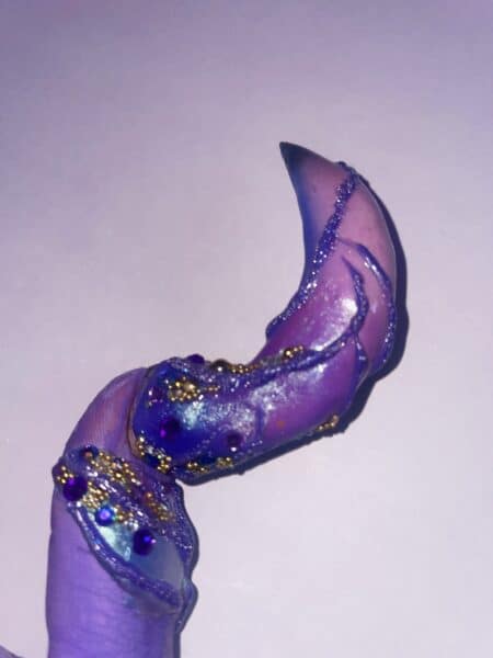 Purple glitter unicorn figurine close-up
