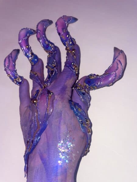 Purple and blue sculpted acrylic nails with glitter gems
