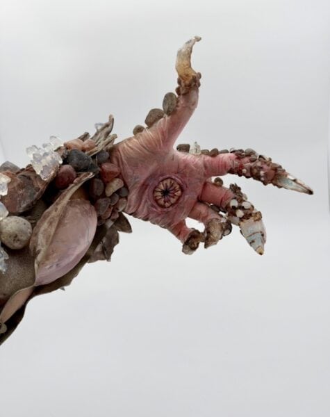Close-up of a fantasy creature sculpture with crystal claws