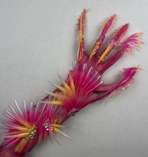 Abstract pink and yellow resin strokes on pale grey background