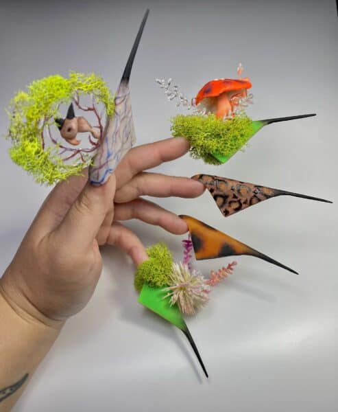 Fantasy stiletto nails with moss, mushroom and unicorn designs
