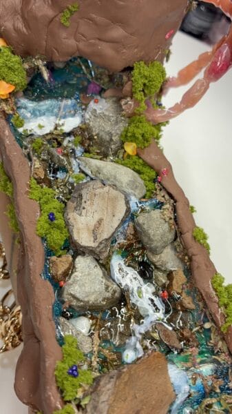 Handcrafted miniature waterfall with moss and stones