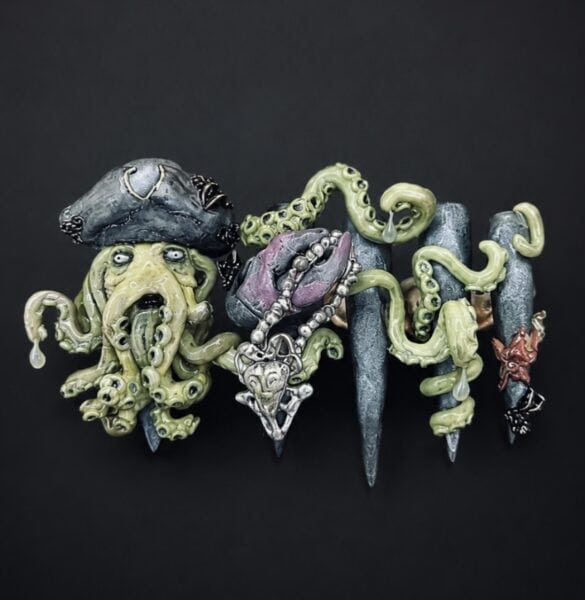 Tentacled pirate creature sculpture with skull pendant and spikes