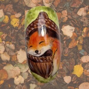 Fox-themed nesting doll among fallen autumn leaves