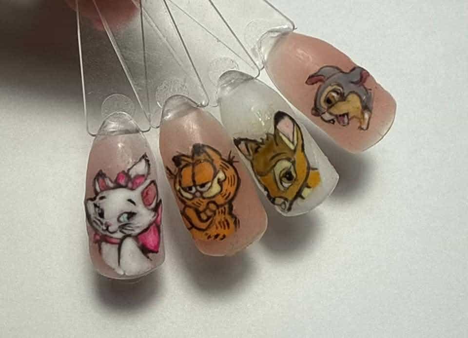 Character nail art on clear artificial nail tips