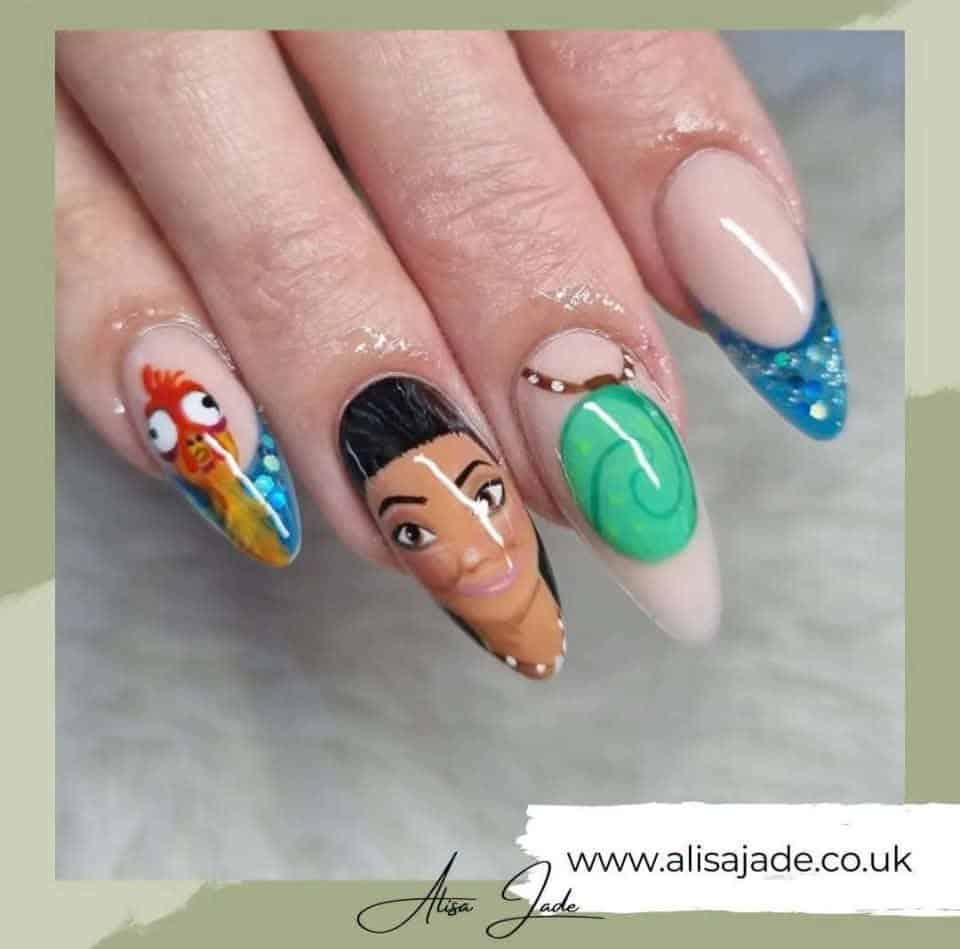 Moana-themed acrylic nails with glittery blue ocean tips