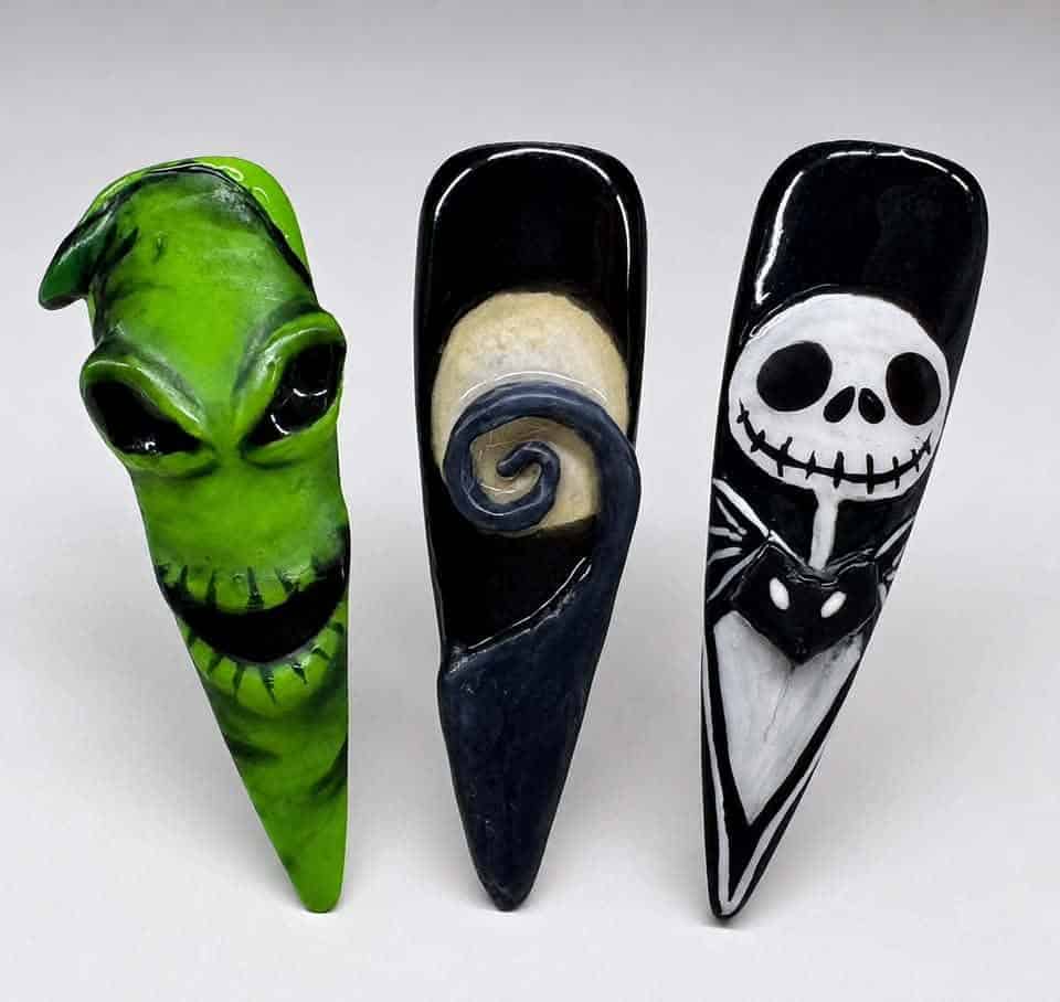 Three hand-painted horror-themed decorative nails