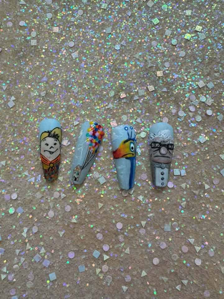 Four colourful character nail art designs on glittery background