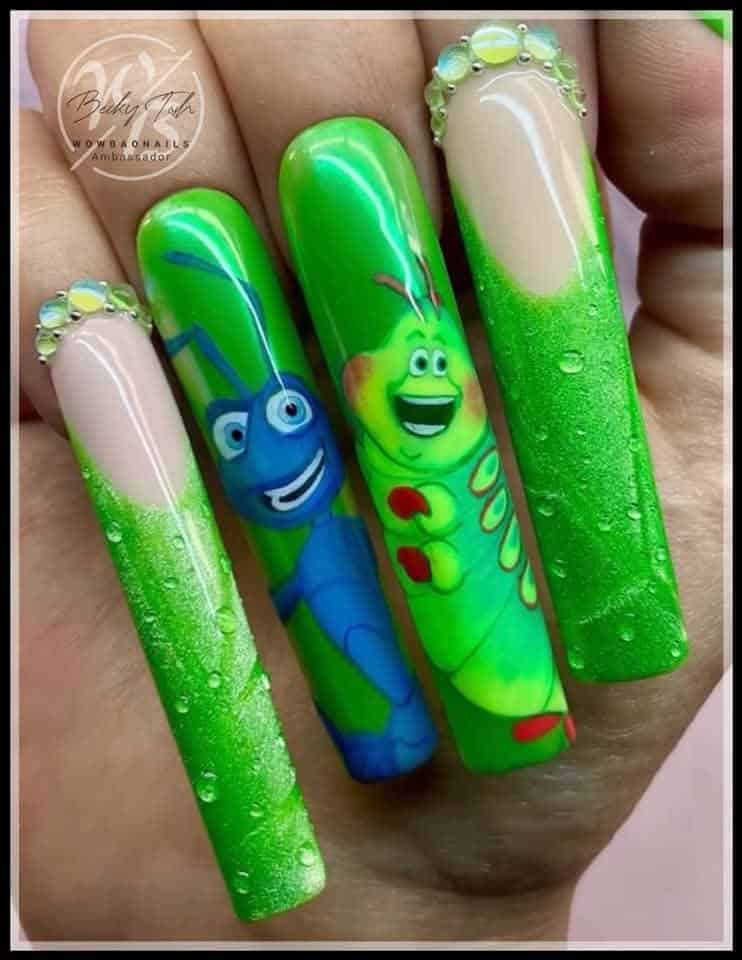 Green glitter nails with cartoon insect character designs
