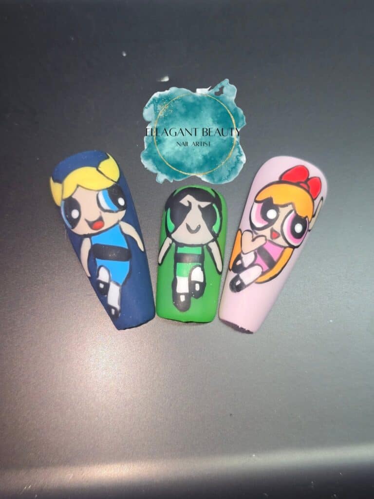Three cartoon character nail-art designs on display nails