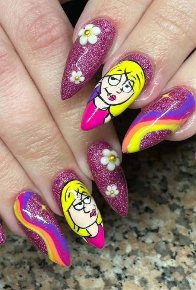 Glittery pink nails with cartoon faces, flowers and rainbow stripes