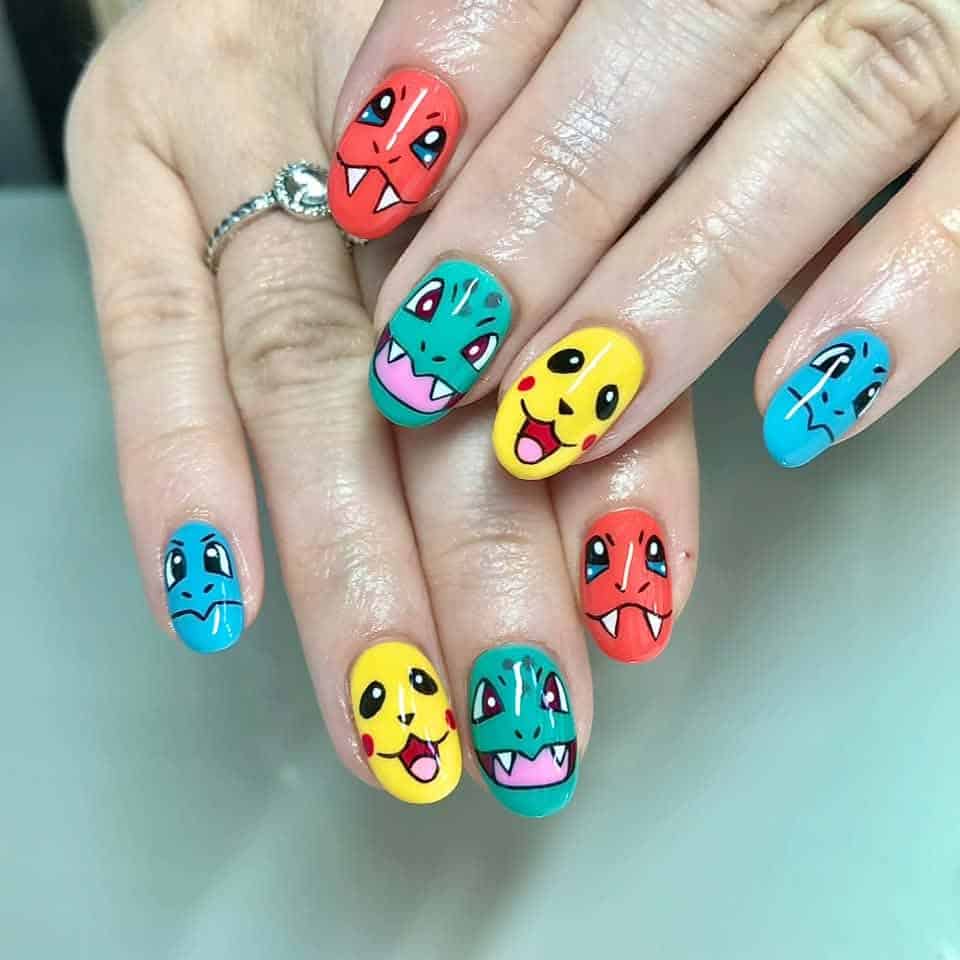 Hands with colourful Pokémon character nail art