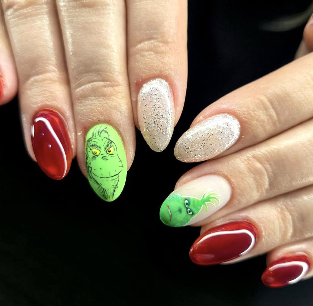 Grinch-inspired Christmas nail art with red and glitter nails